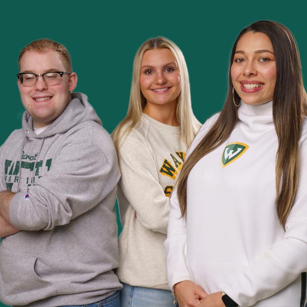 Three diverse individuals wearing Wayne State University apparel