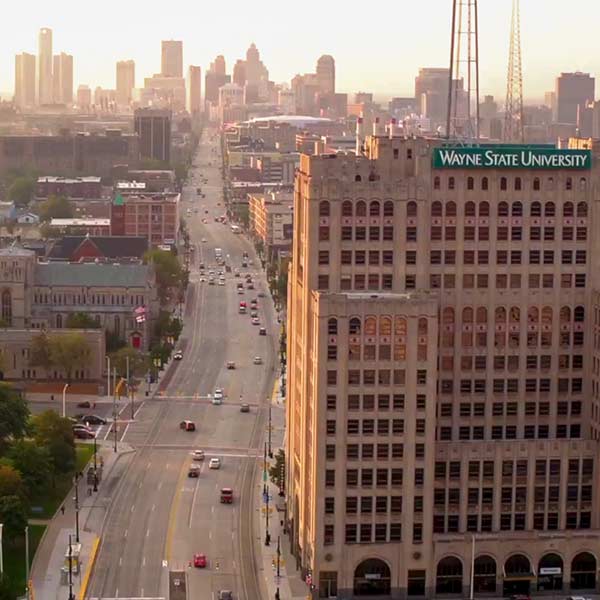 Aerial view of Woodward Avenue showing Wayne State University buildings and the Detroit skyline