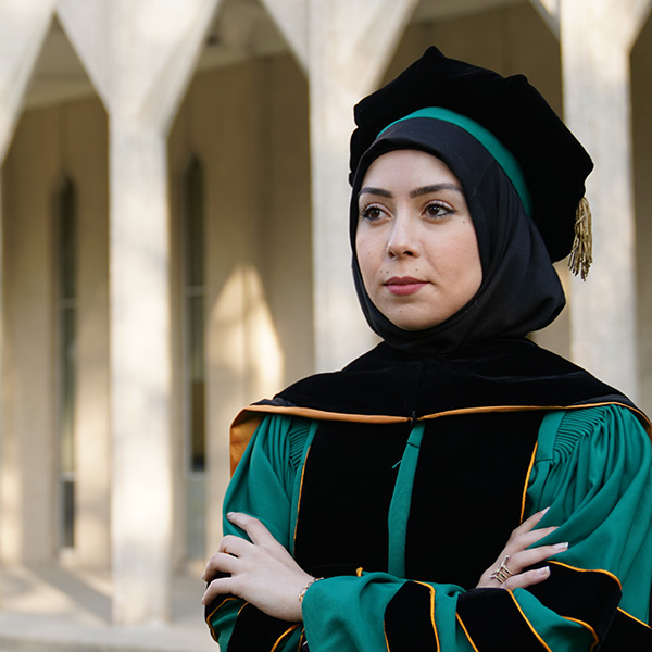 A woman in her graduation robe