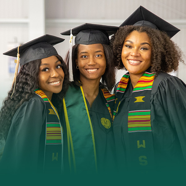 Three black women in graduation dress