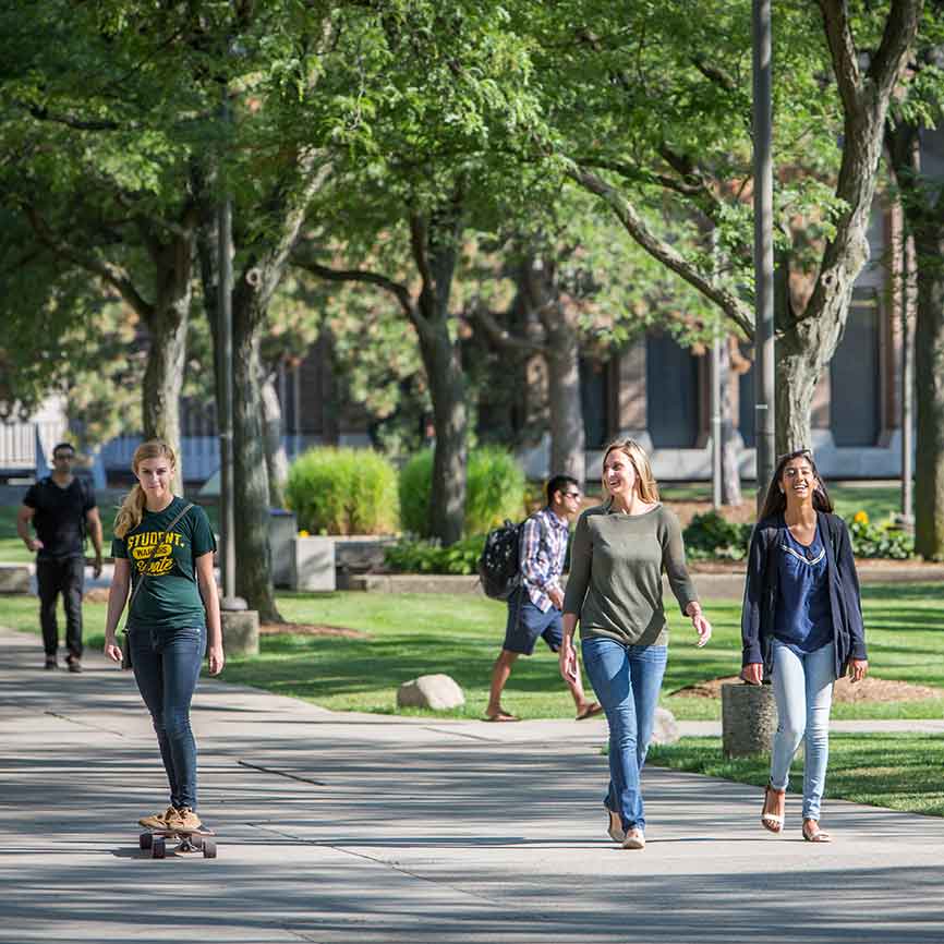 Students walking casually on campus
