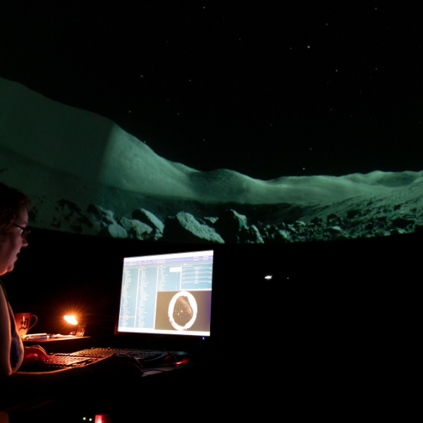 Planetarium presentation presenter navigating a planet