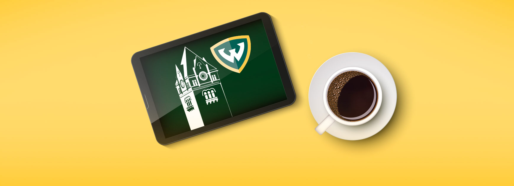A coffee cup and a tablet with Old Main and Wayne State logo on the screen