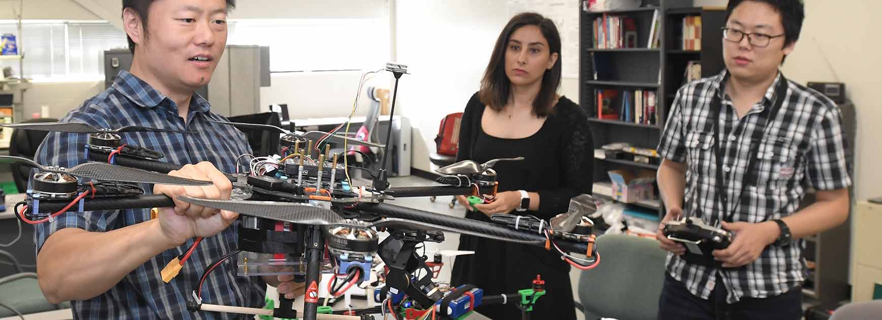 Engineering students working on a drone